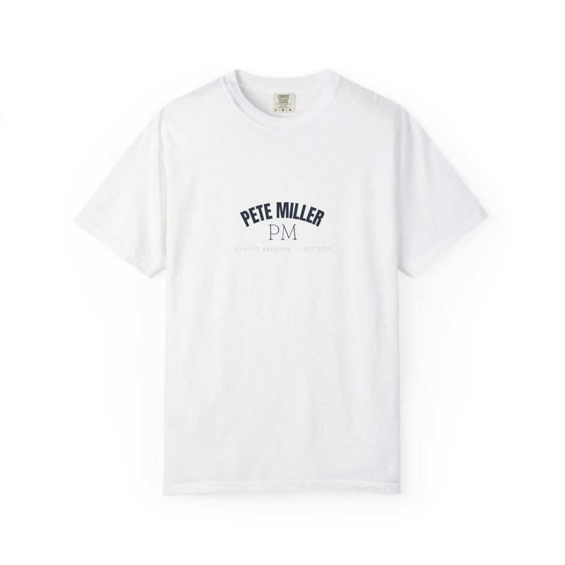 Pete Miller Varsity Tee, front view - arched PETE MILLER collegiate lockup high on the chest of a white garment-dyed heavyweight tee